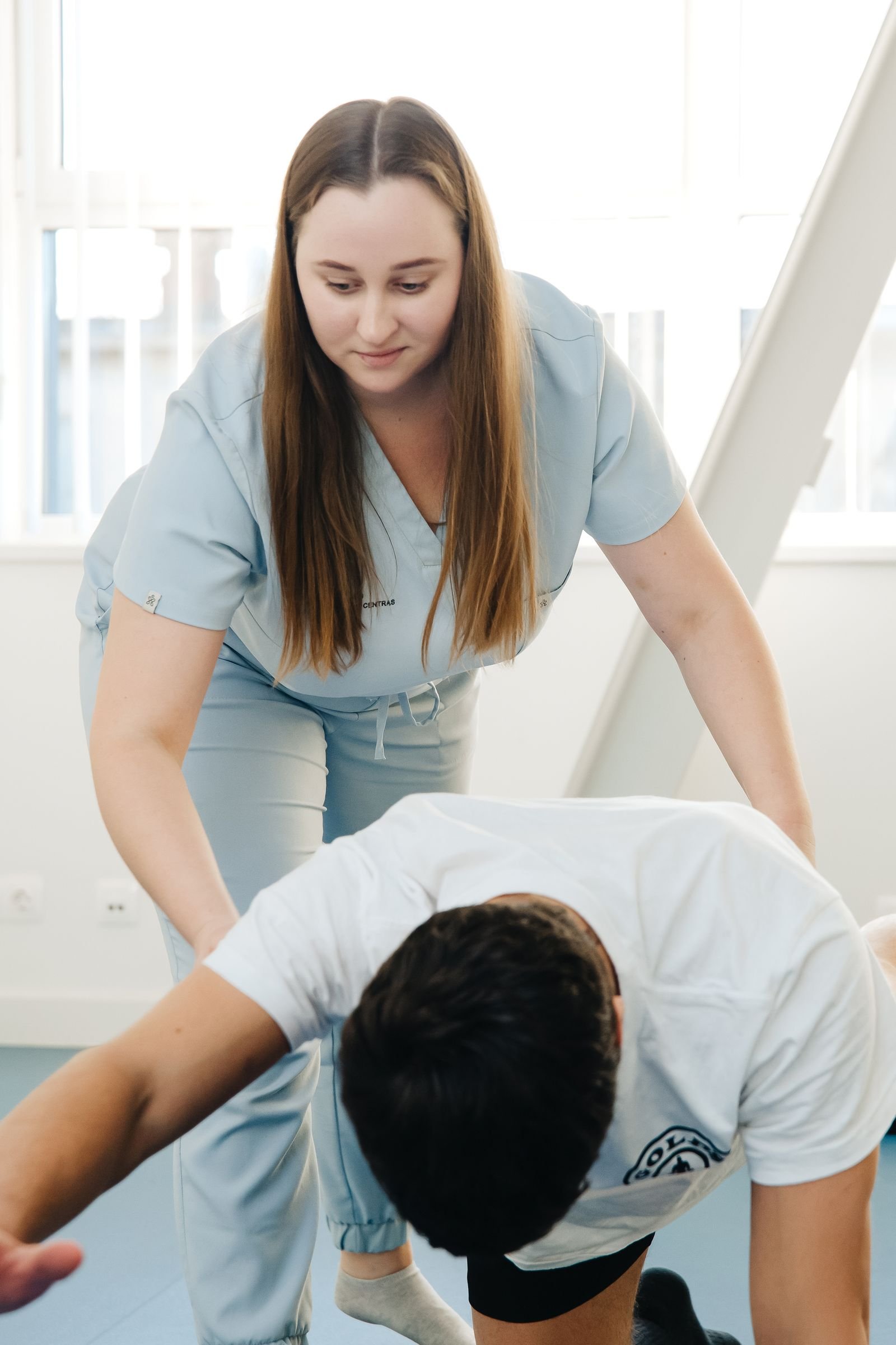 Assisted rehabilitation exercise — illustrative stock photograph